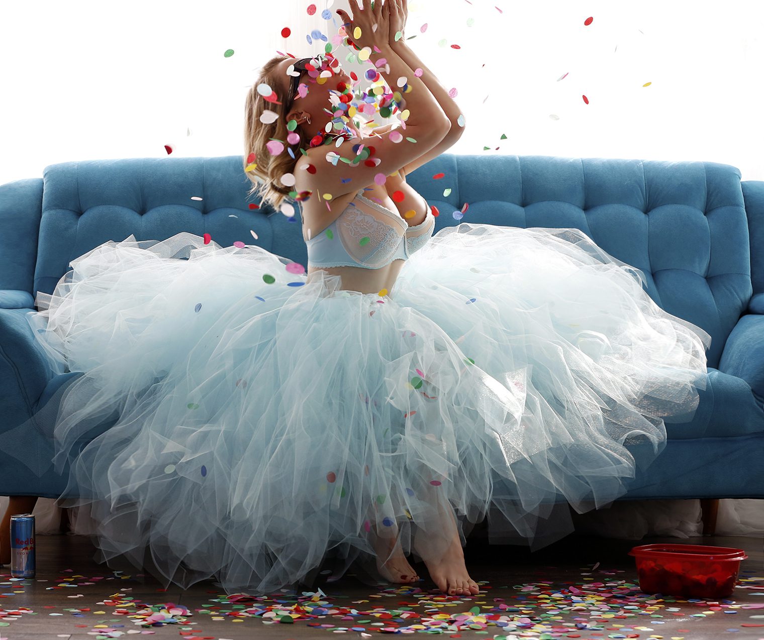 Megan Love wearing blue tutu and throwing confetti