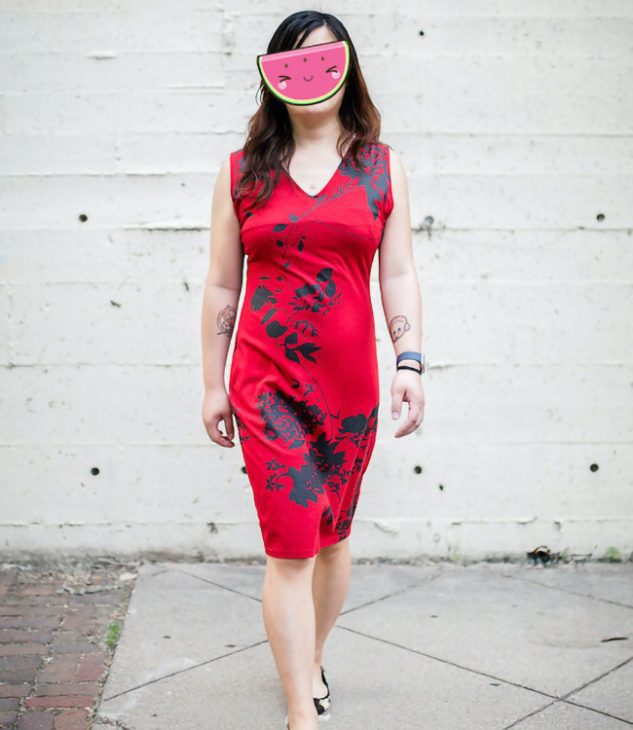 McKenzie Gold, an Asian escort in Minneapolis, in a red dress.